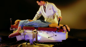 This is a picture of Cox Technic chiropratic spinal manipulation as performed at Aaron Chiropractic Clinic.